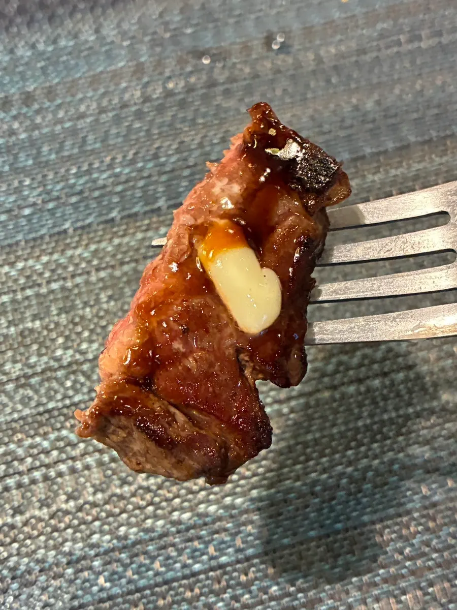 A plate with several cuts of steak ordered together