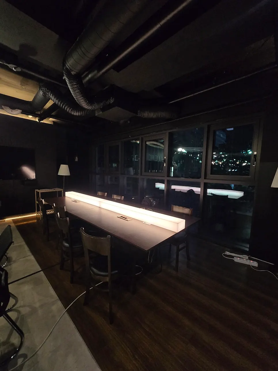 Dimly lit shared table on the 8th floor