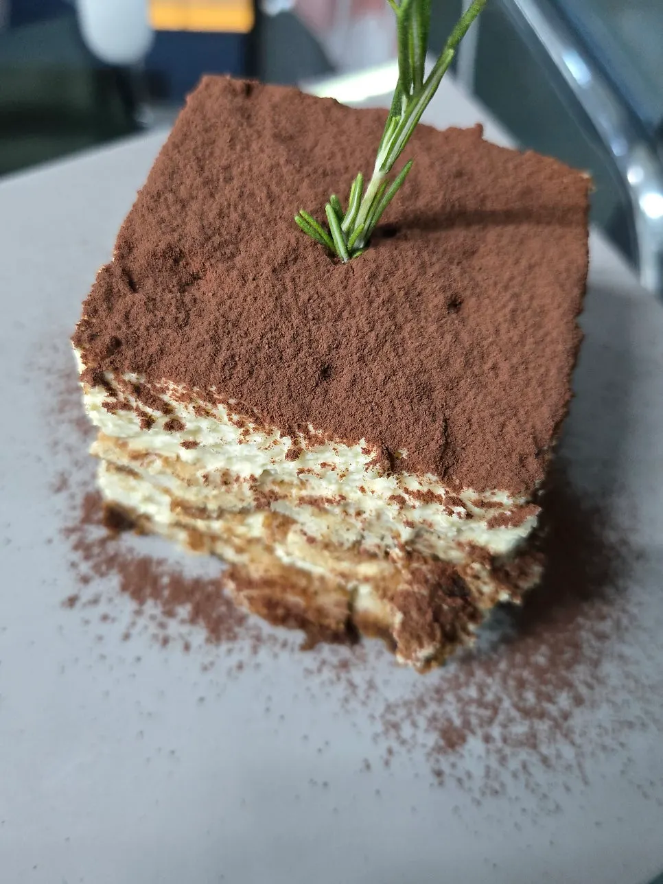 Tiramisu showing thick cream and sponge layers