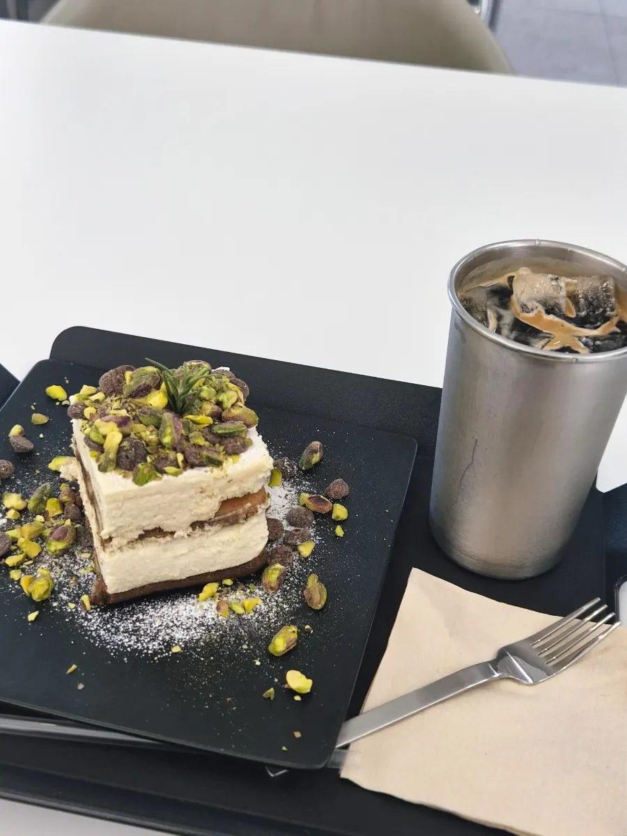 A table with coffee and tiramisu enjoyed together