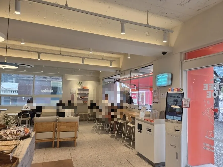 Spacious café interior with orange circular decorations
