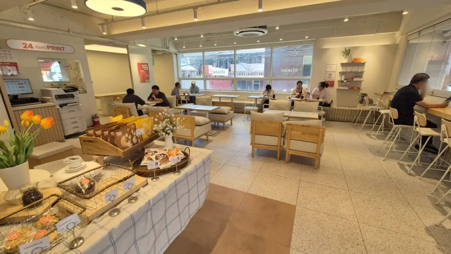 Bright café interior lit by floor-to-ceiling windows