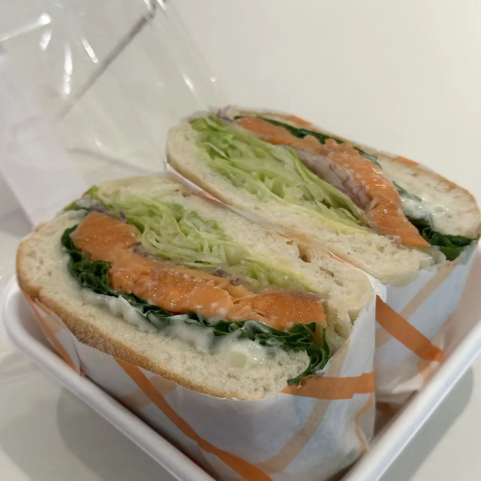 Salmon sandwich and coffee on the table