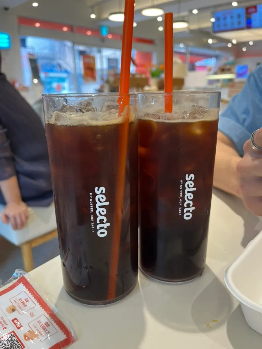 Table with ordered coffee and sandwich
