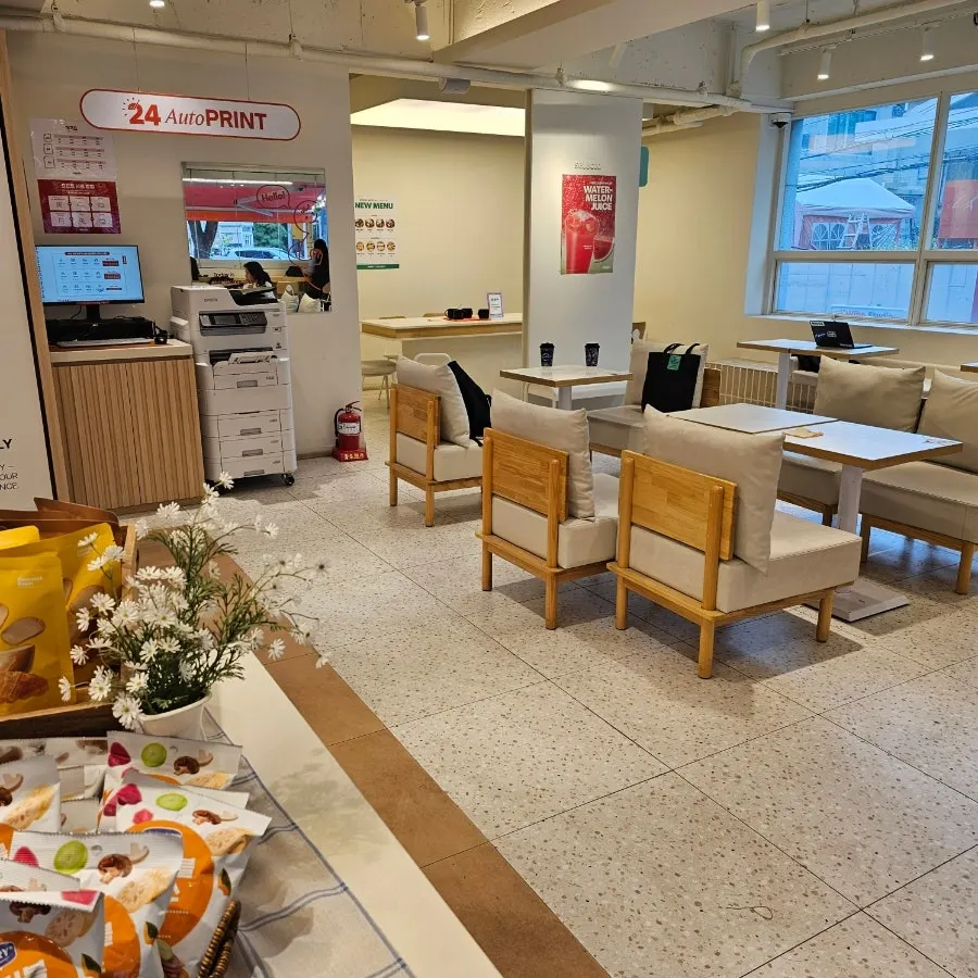 Seats at Selecto Coffee Sinnonhyeon Branch with a customer studying