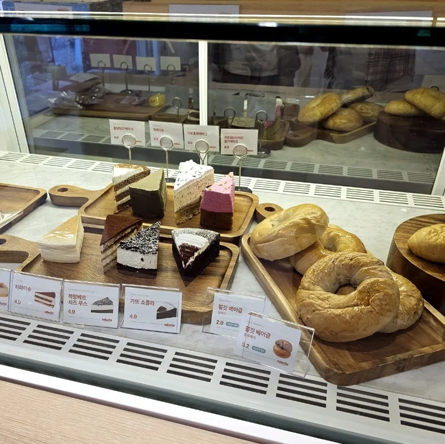 Shelf of bagels and baked goods