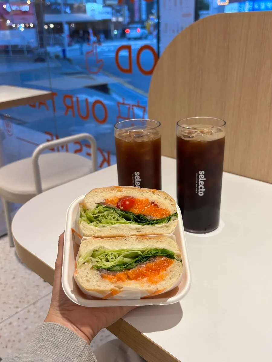 Sandwich placed alongside the coffee