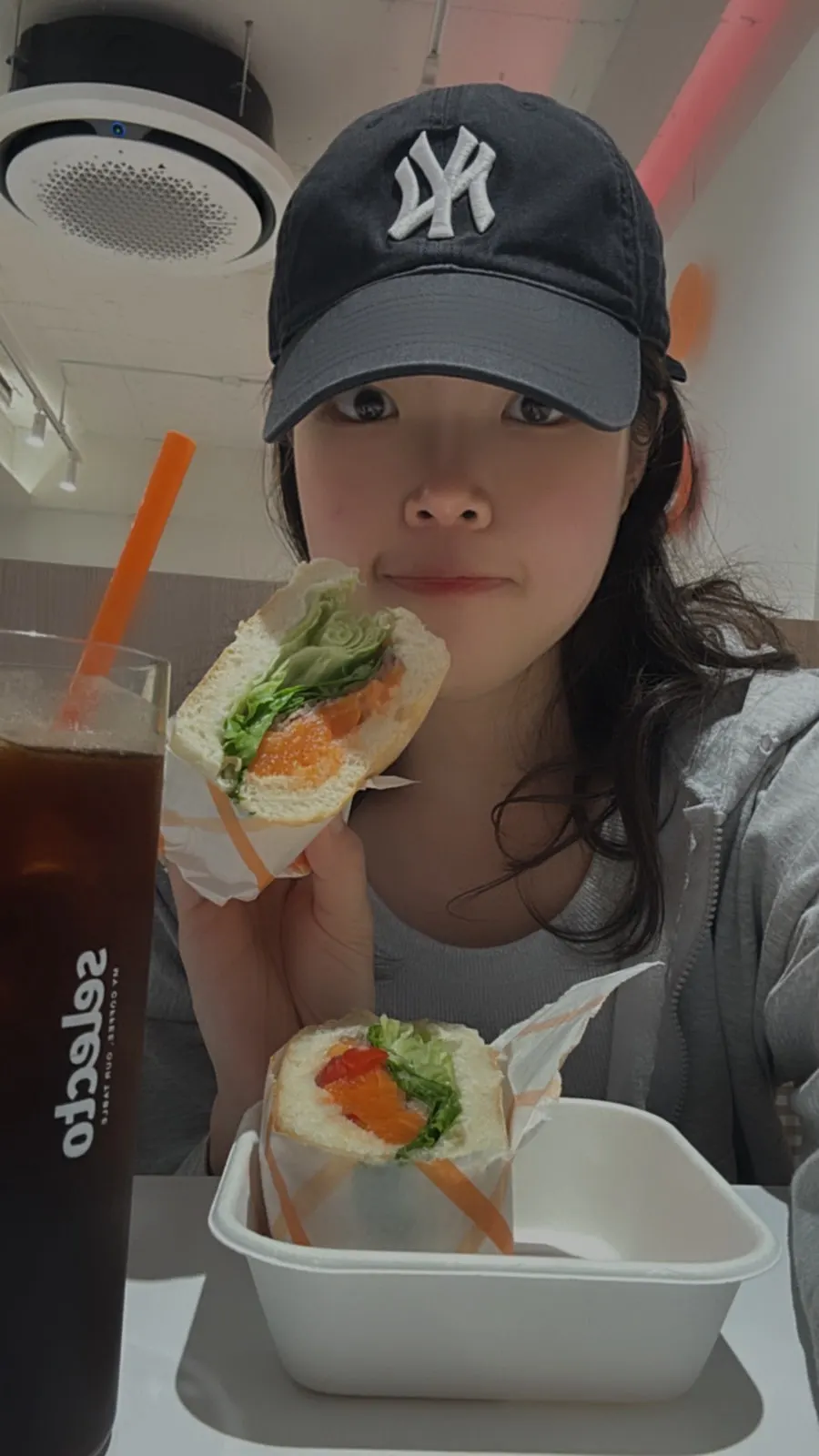 Photo at the seat holding the sandwich