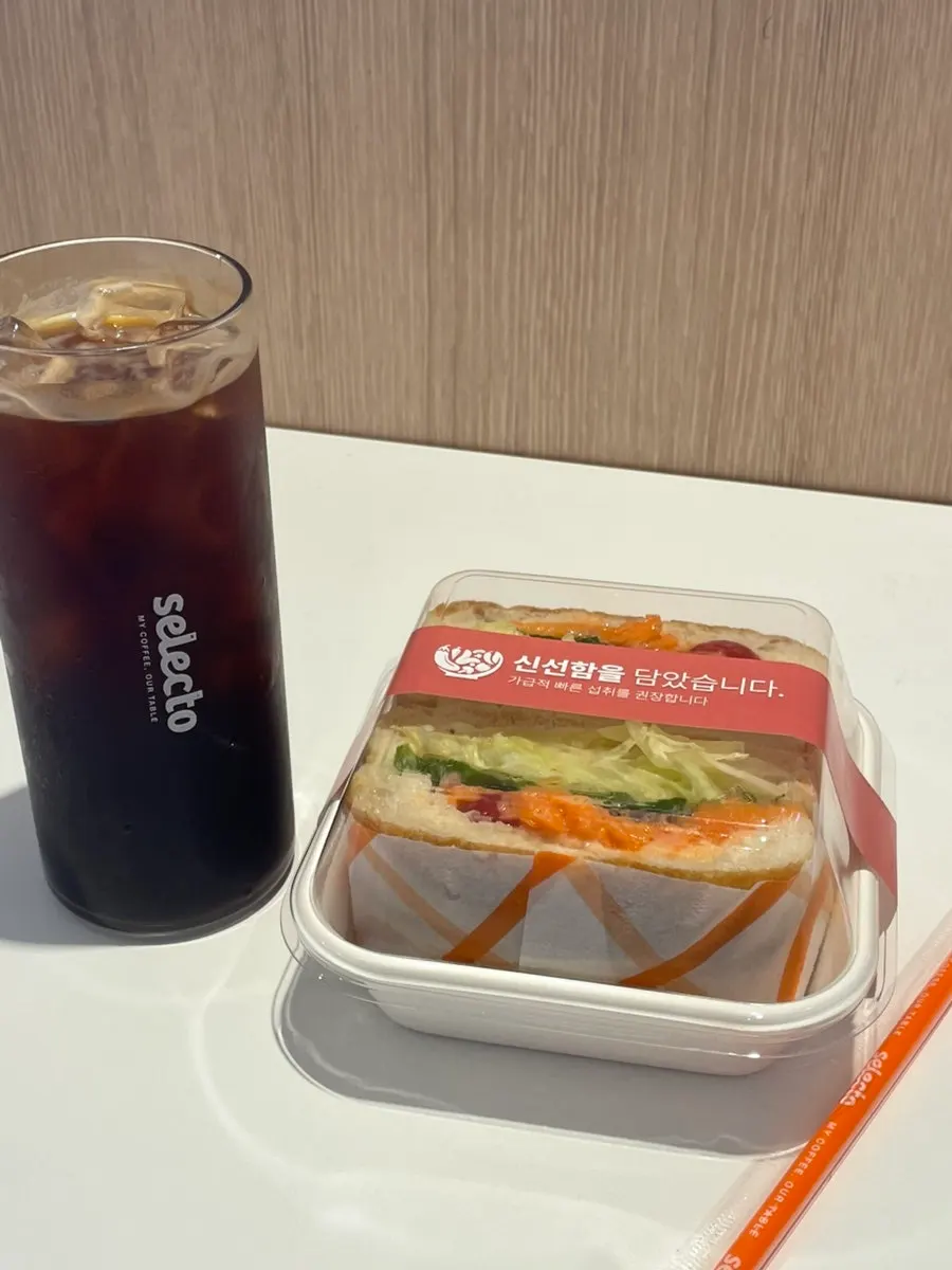 Americano and smoked salmon sandwich on the table