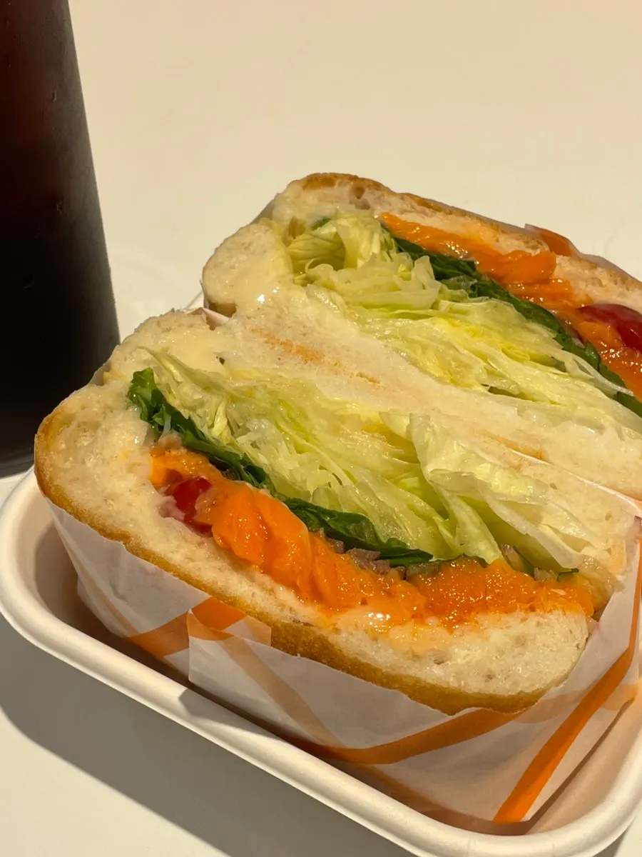 Unwrapped smoked salmon sandwich