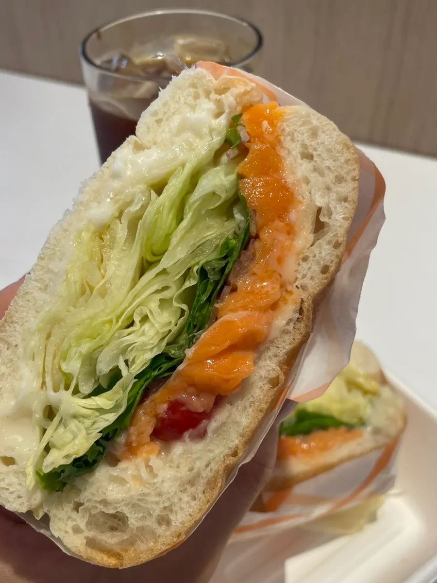 Cross-section of the ciabatta bread filled with salmon and vegetables