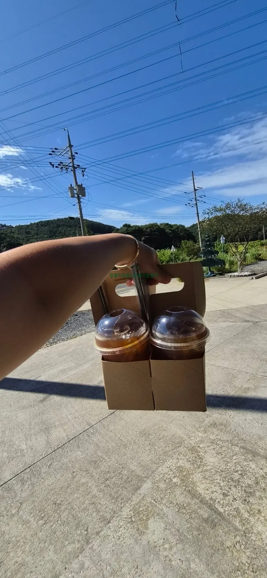 Four iced Americanos to go
