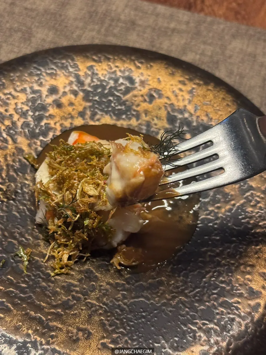 Shrimp dish topped with celeriac and Brussels sprouts