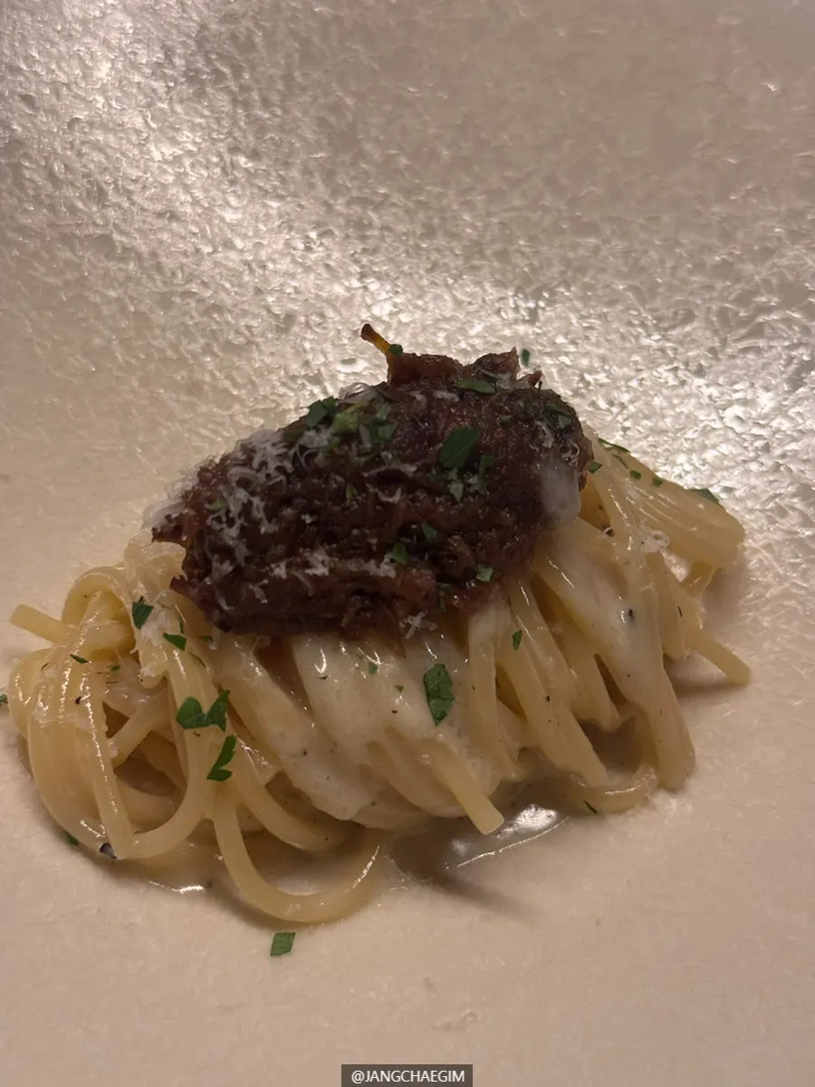 Pecorino Genovese spaghetti topped with white ragu