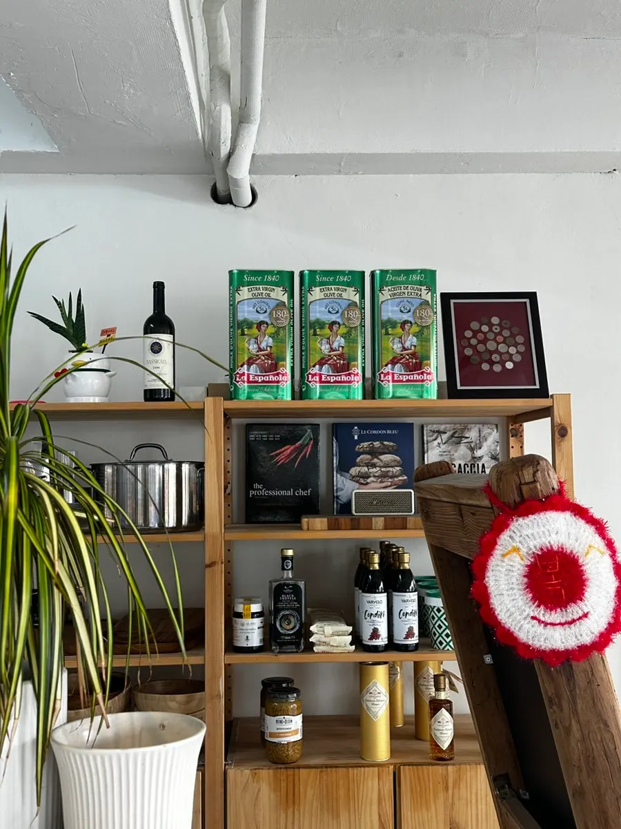 Italian ingredients displayed on wooden shelves