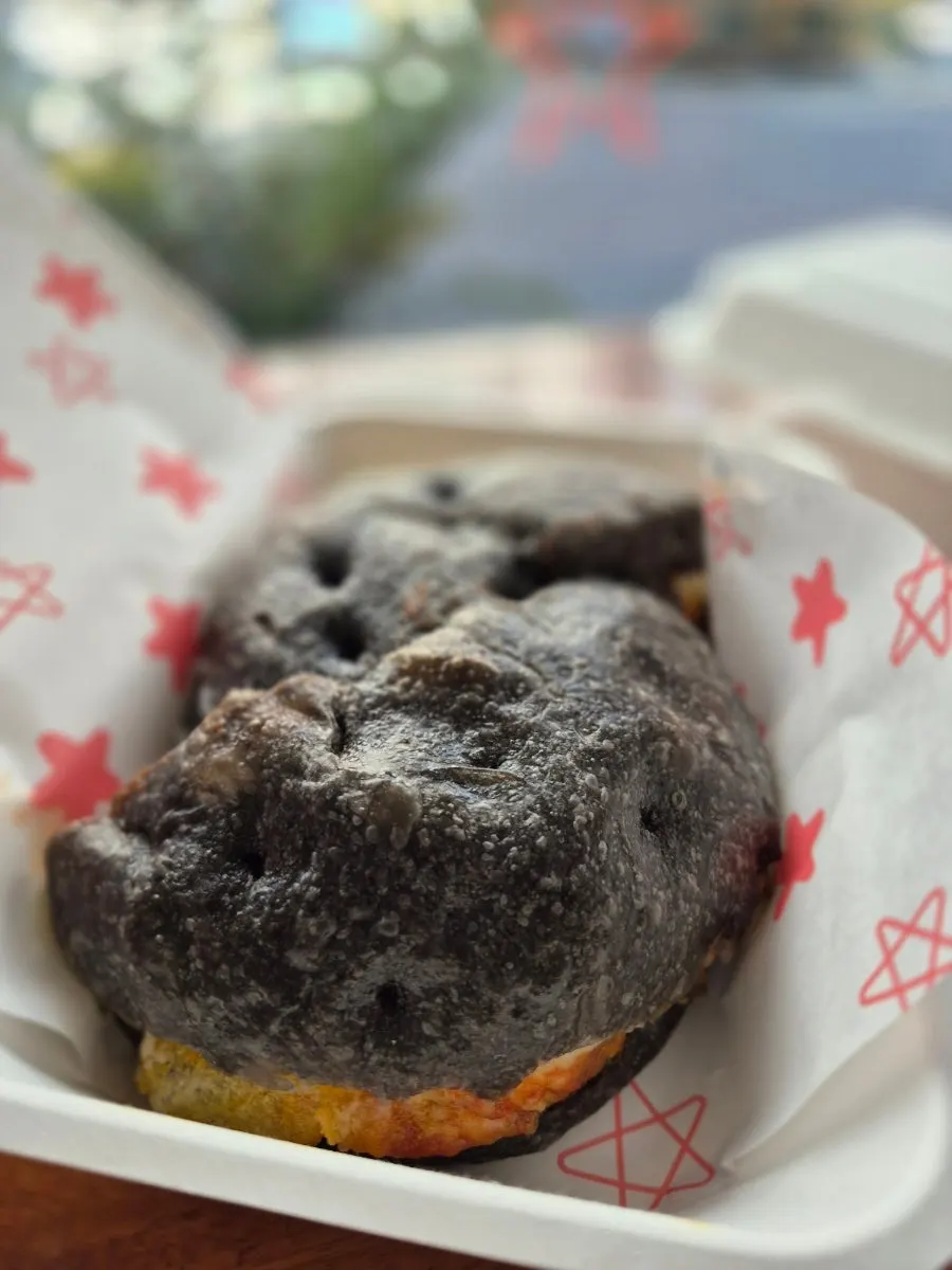 Squid ink focaccia sandwich on a plate