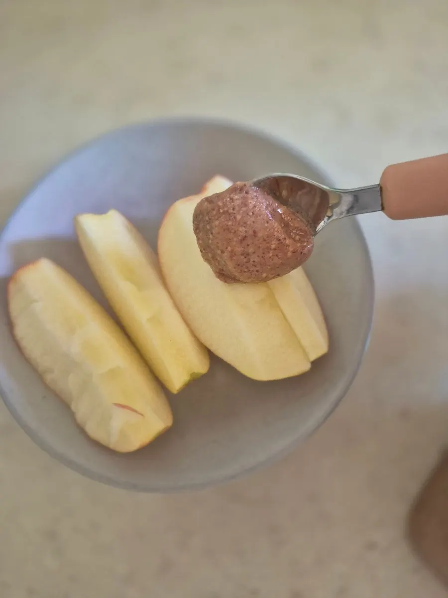 Handmade peanut butter spread on apple slices