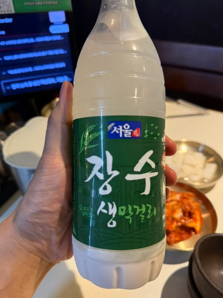 A bottle of Jangsu makgeolli on the table