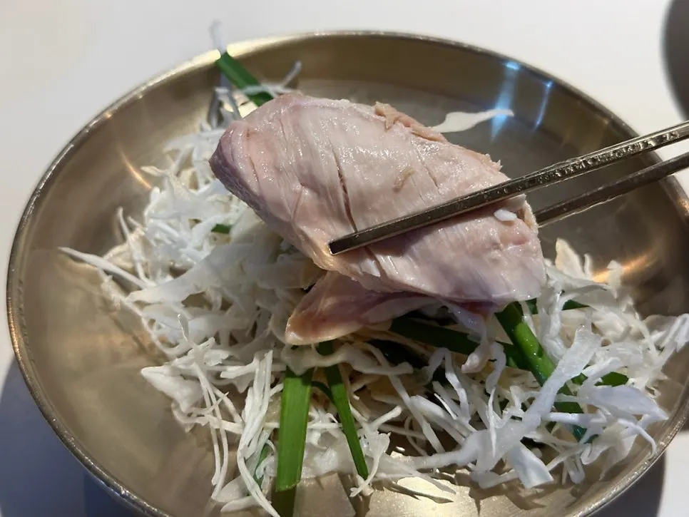 Chicken meat wrapped with cabbage and chive salad