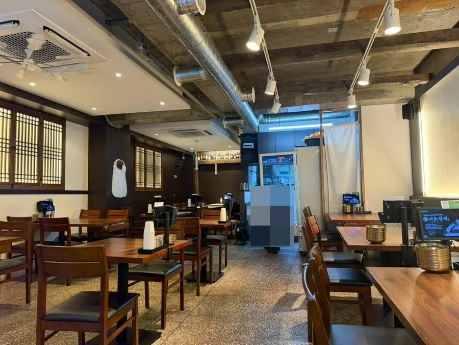 Interior of Seocho Jeonggye with hanok-style window frames