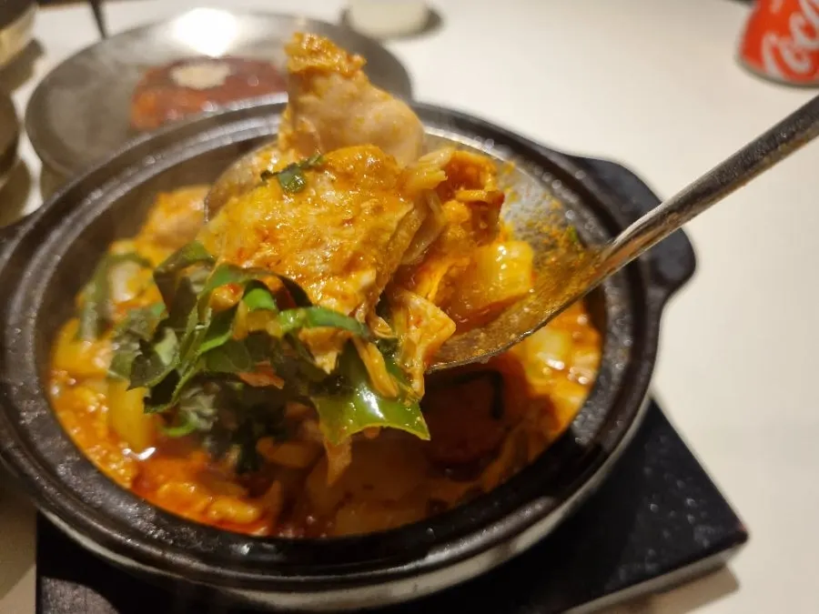 Boneless dak-bokkeumtang served with a bowl of rice