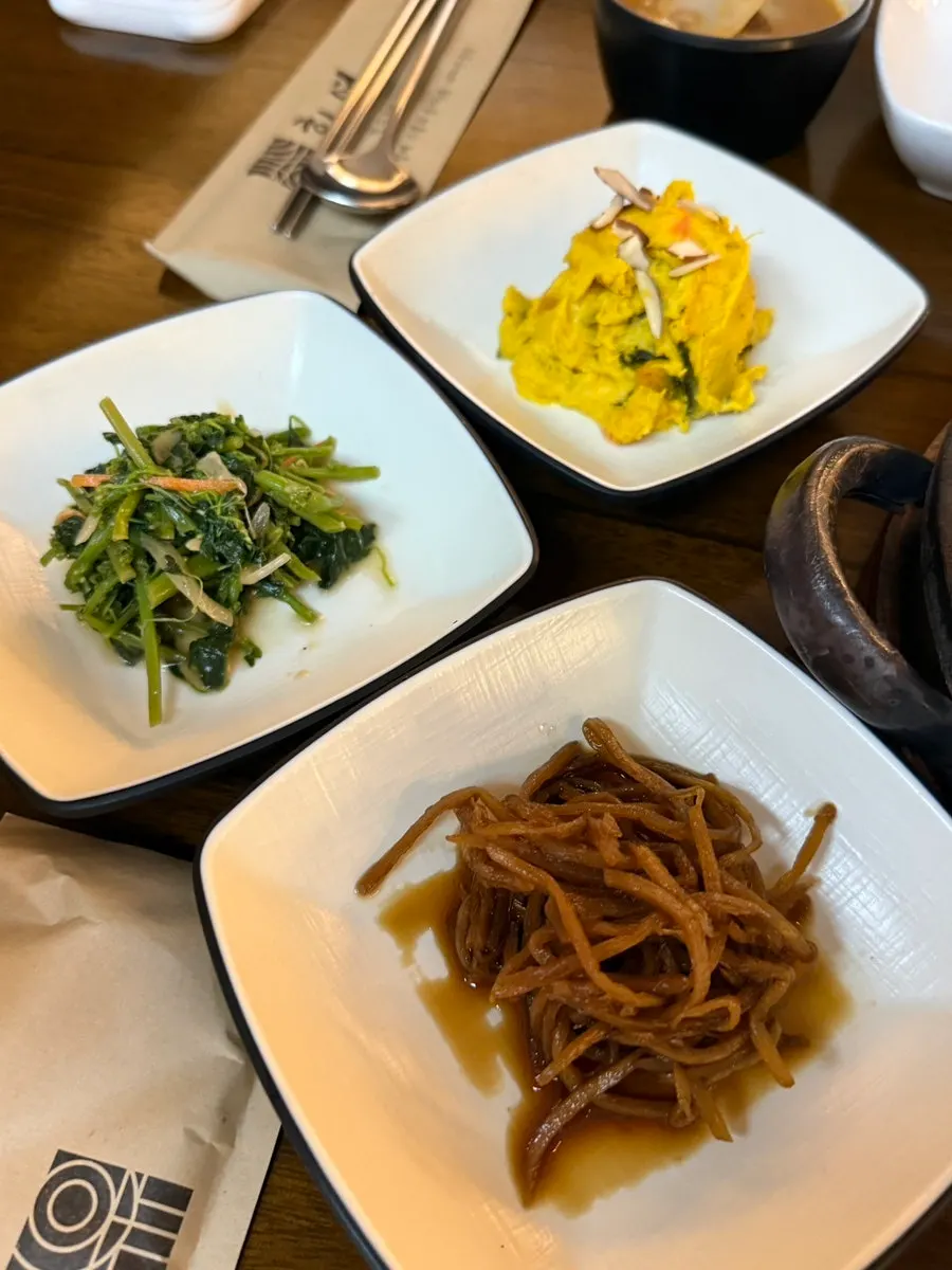 A table spread with six side dishes