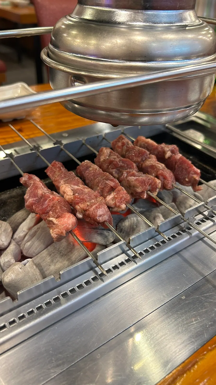 Lamb skewers set on the rotating grill
