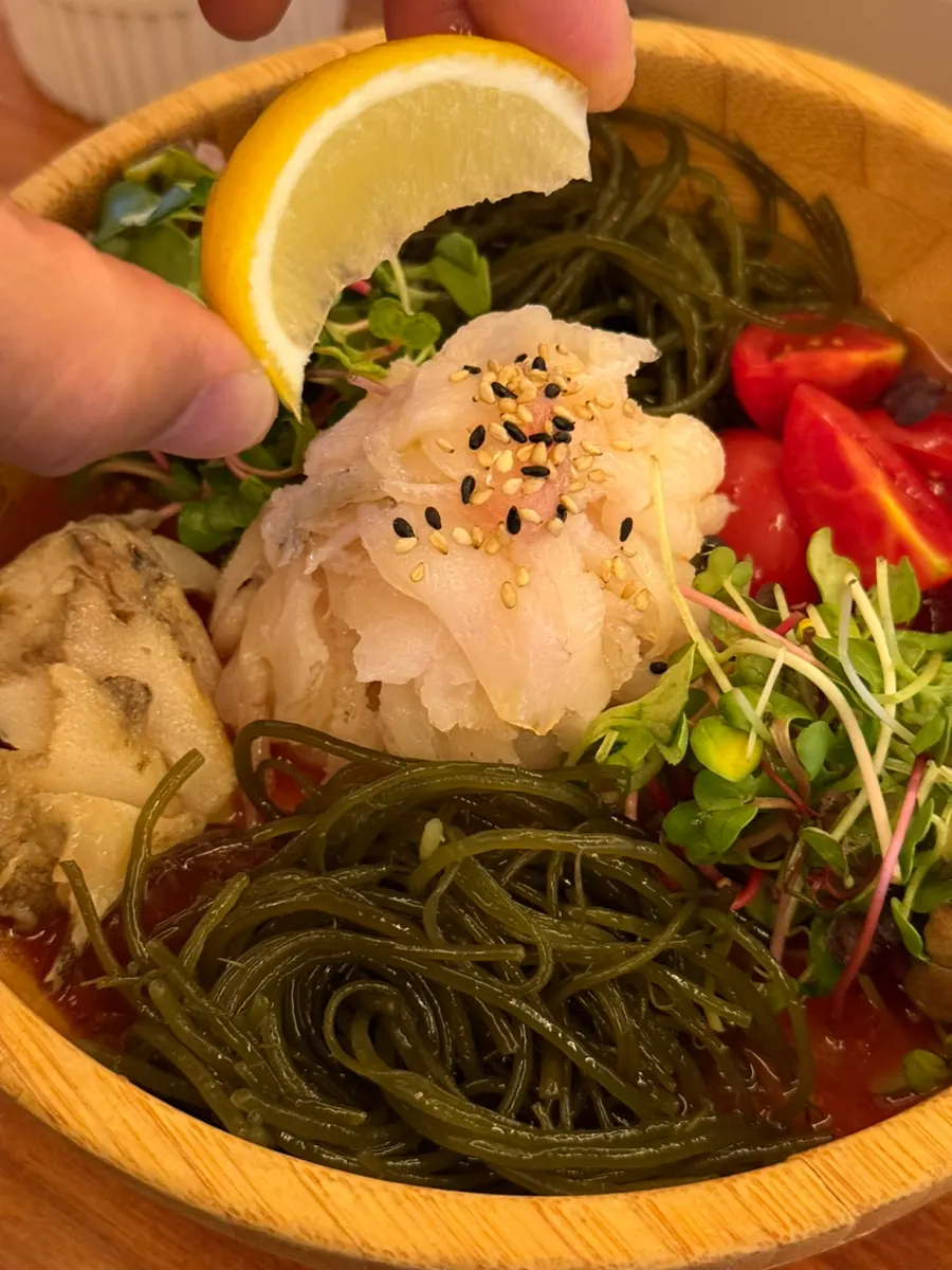 Close-up of tomato mulhoe with vegetables and cool broth