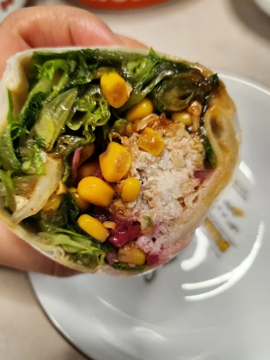 Chicken-breast wrap eaten with one hand