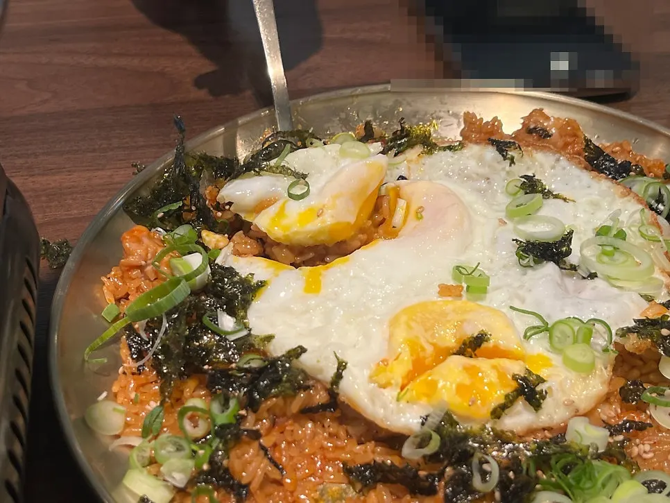 Plate of chicken cartilage fried rice topped with seaweed flakes