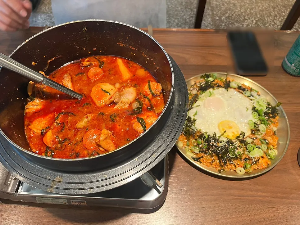 Table spread with both dakbokkeumtang and fried rice