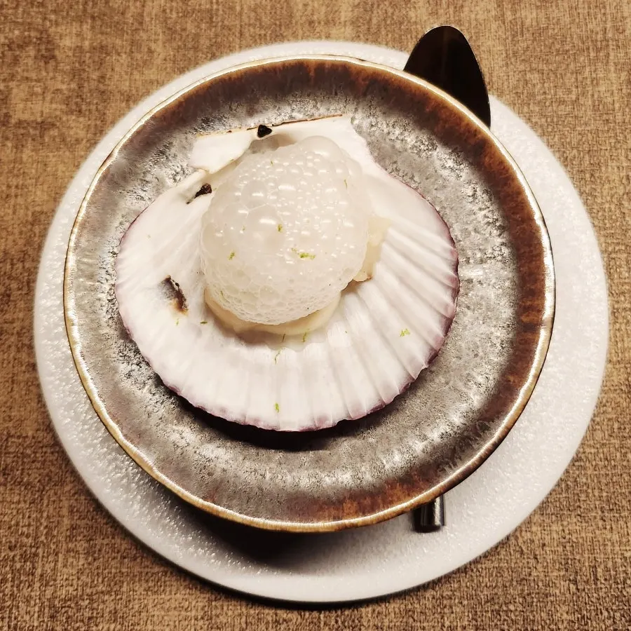 Amuse-bouche of foam-topped scallop with Korean melon