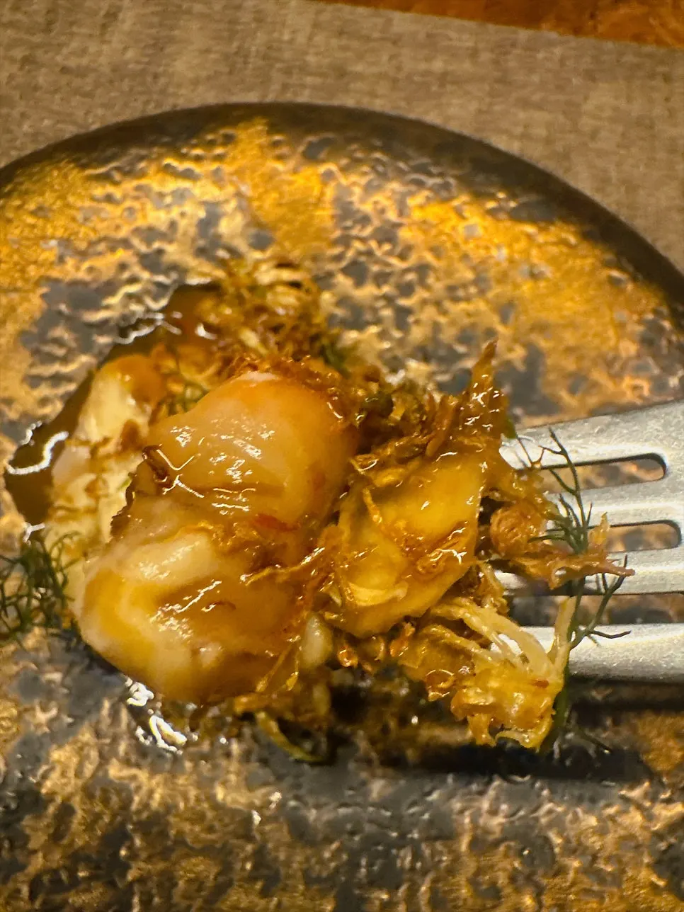 Dipping shrimp meat into the sauce