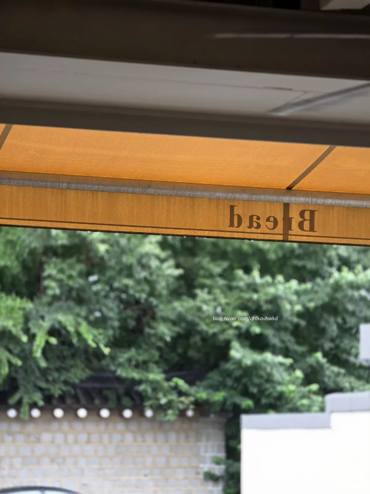 Exterior of Respire Bakery Cafe Seochon on a rainy day