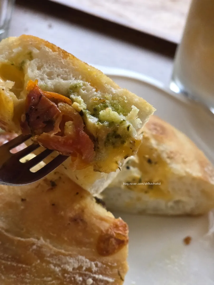 Cross-section of the warmed basil tomato ciabatta