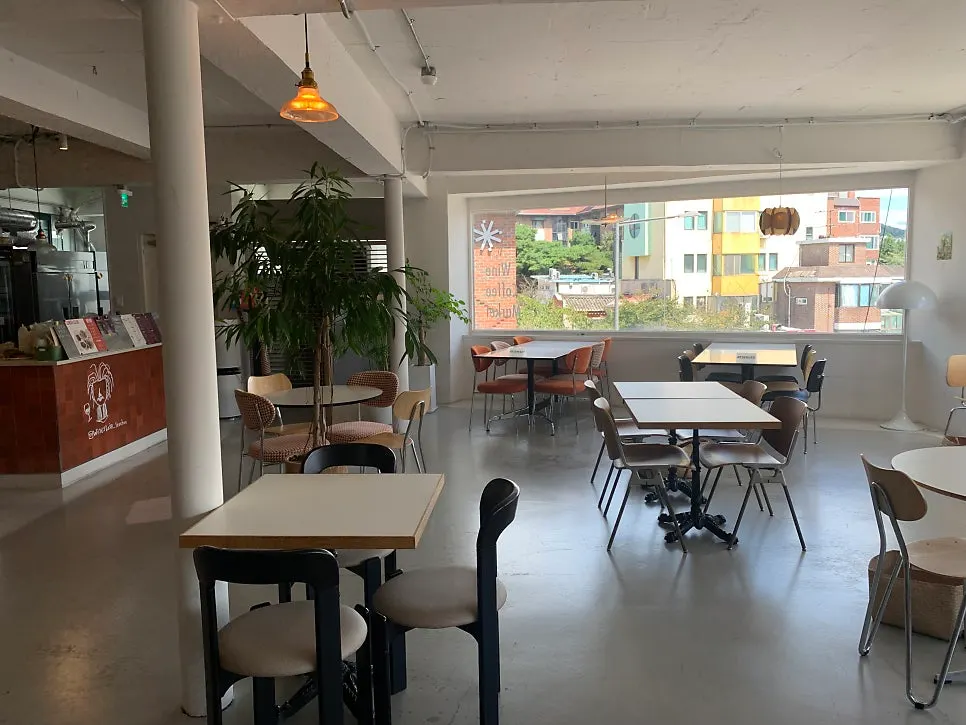 Interior of Wine Stein Seochon with widely spaced tables