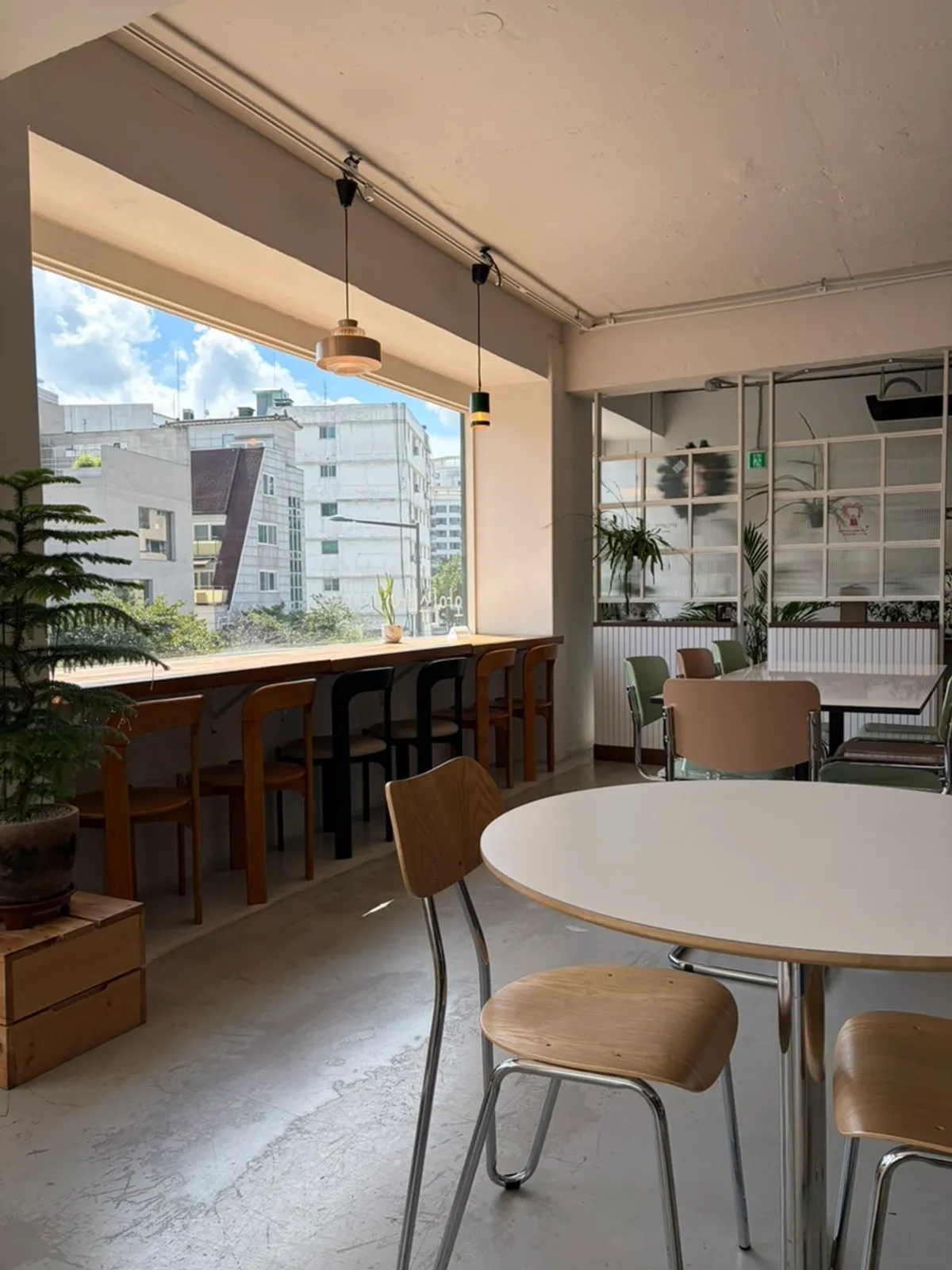 Hanok rooftops visible through the window in Seochon