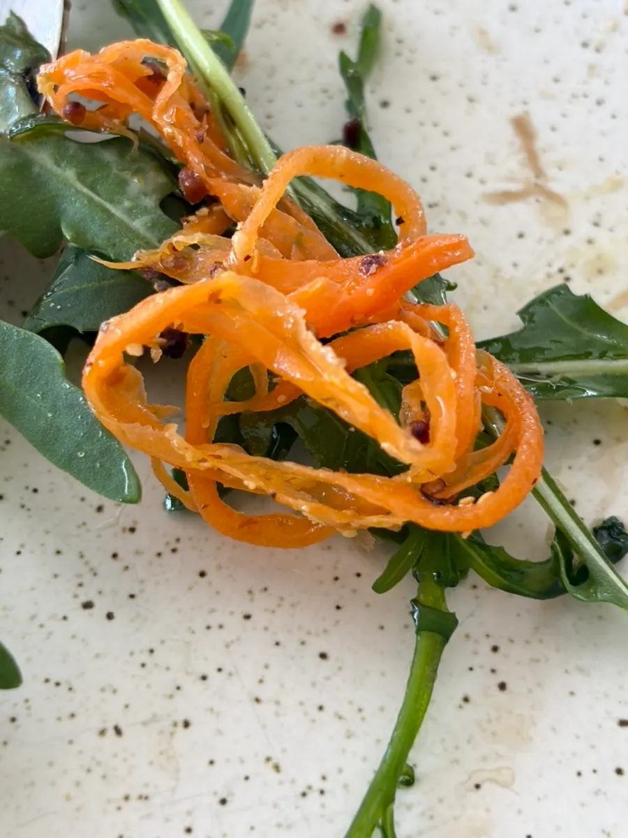 Carrot rapée served with the sandwich