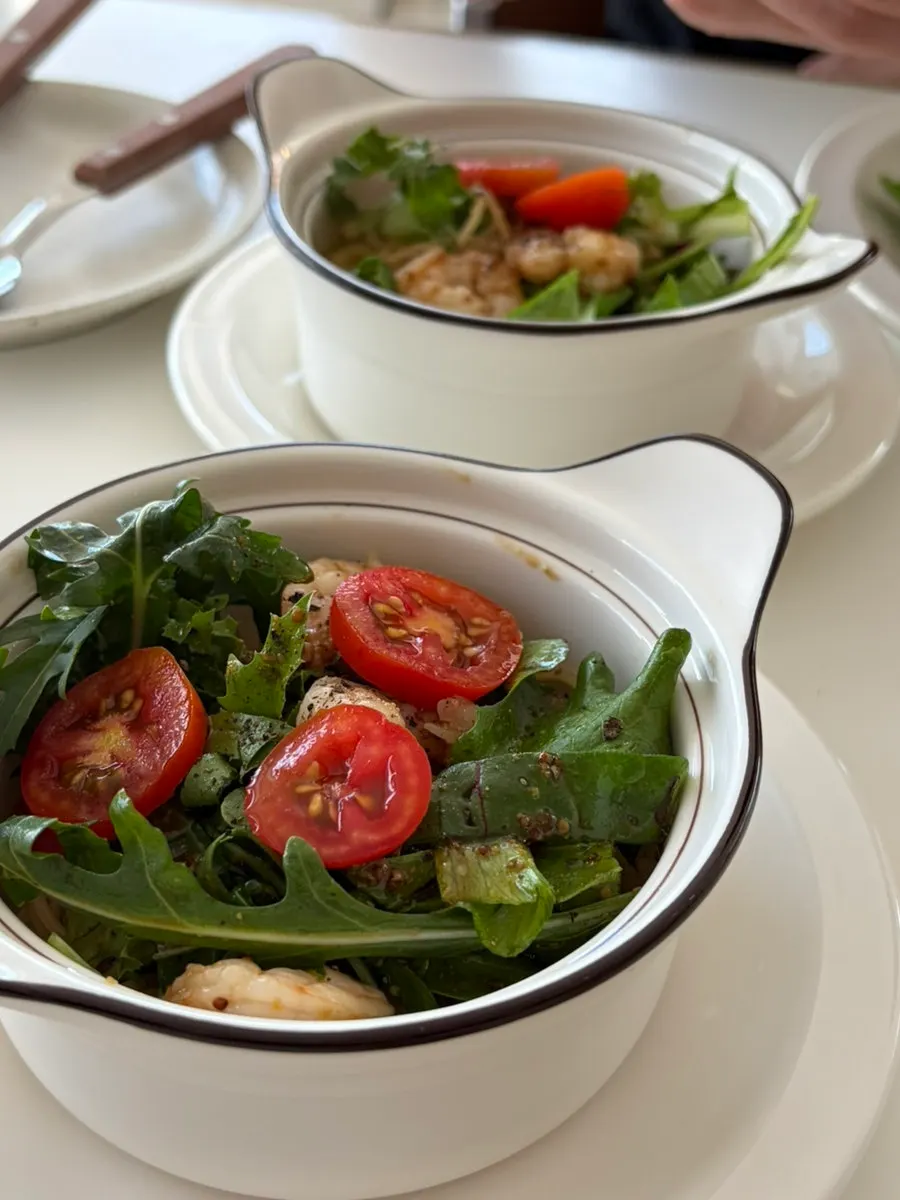 Salad pasta topped with shrimp