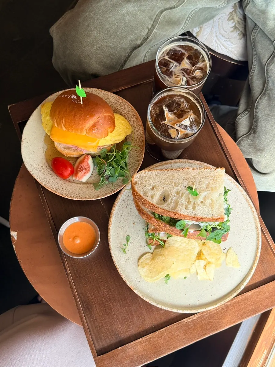 Sandwich cross-section and coffee on the table