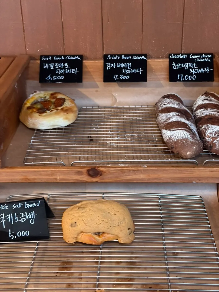 Bread display shelves at Respire Bakery