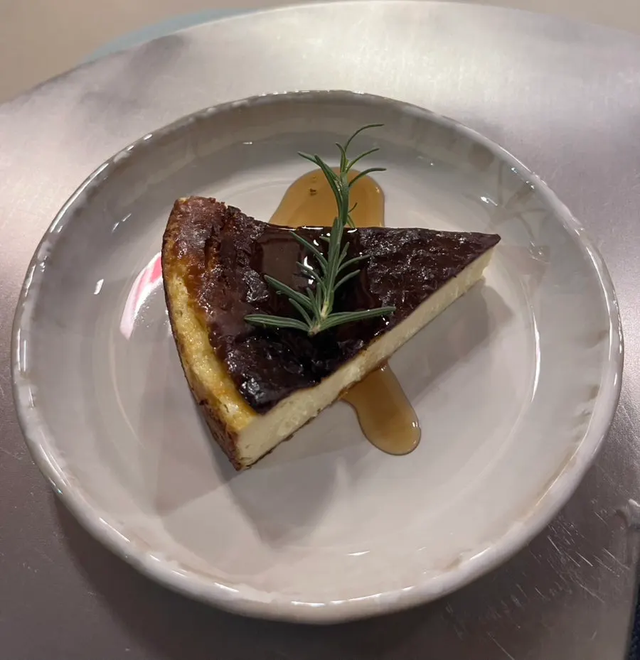 A slice of deeply browned Basque cheese cake