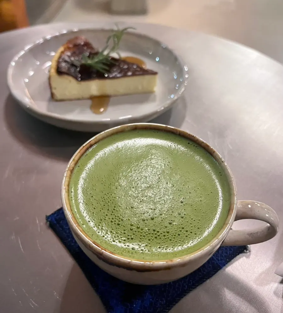 Matcha latte and Basque cheese cake set on the table