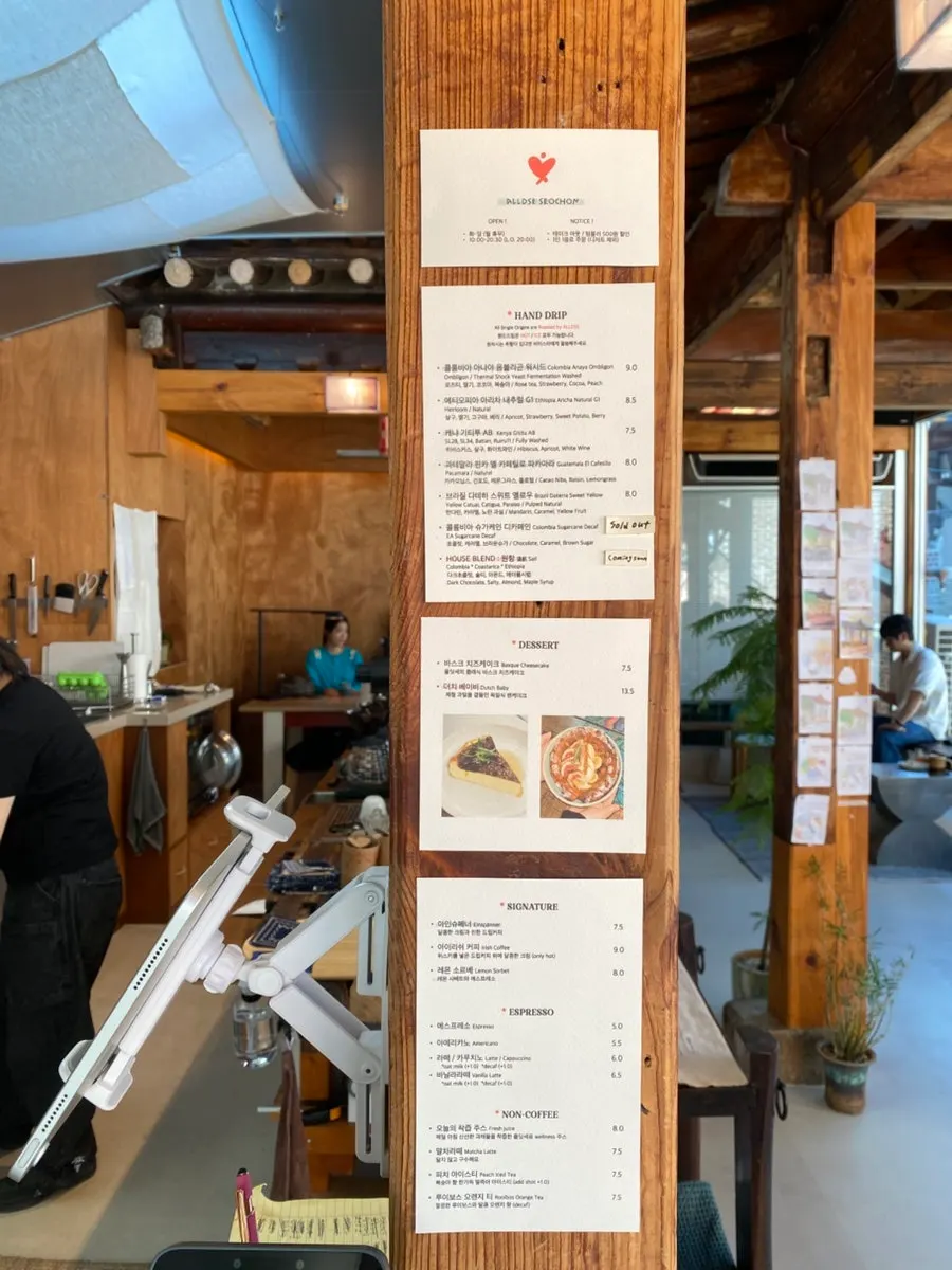 Oldsse Seochon menu posted on a hanok pillar