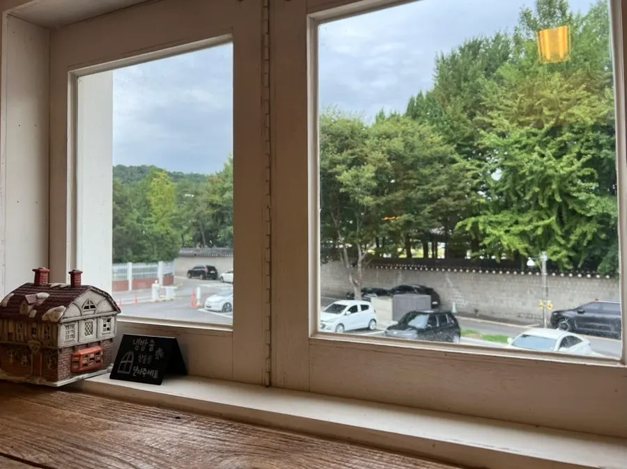 Parking lot in front of the café seen through the window