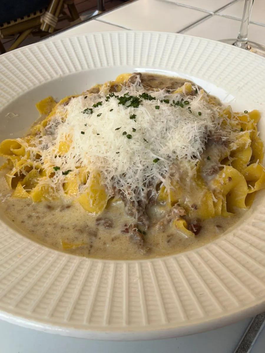 White ragu fresh pasta topped with cheese at Teen Seoul