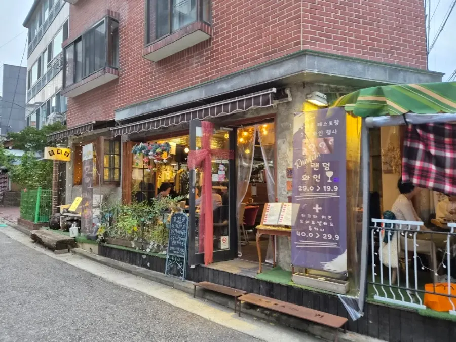 Seochon alley with people passing through