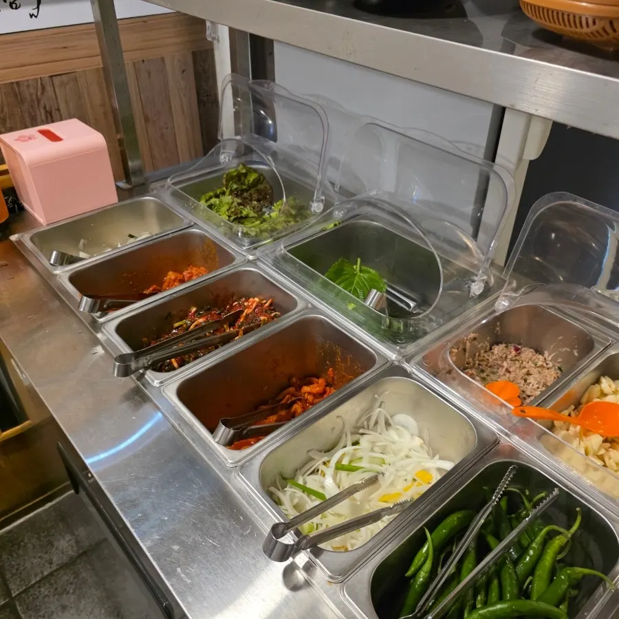 Lettuce wraps and various kimchi at the self-serve bar