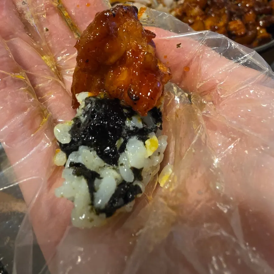 Hand-mixed rice balls being made