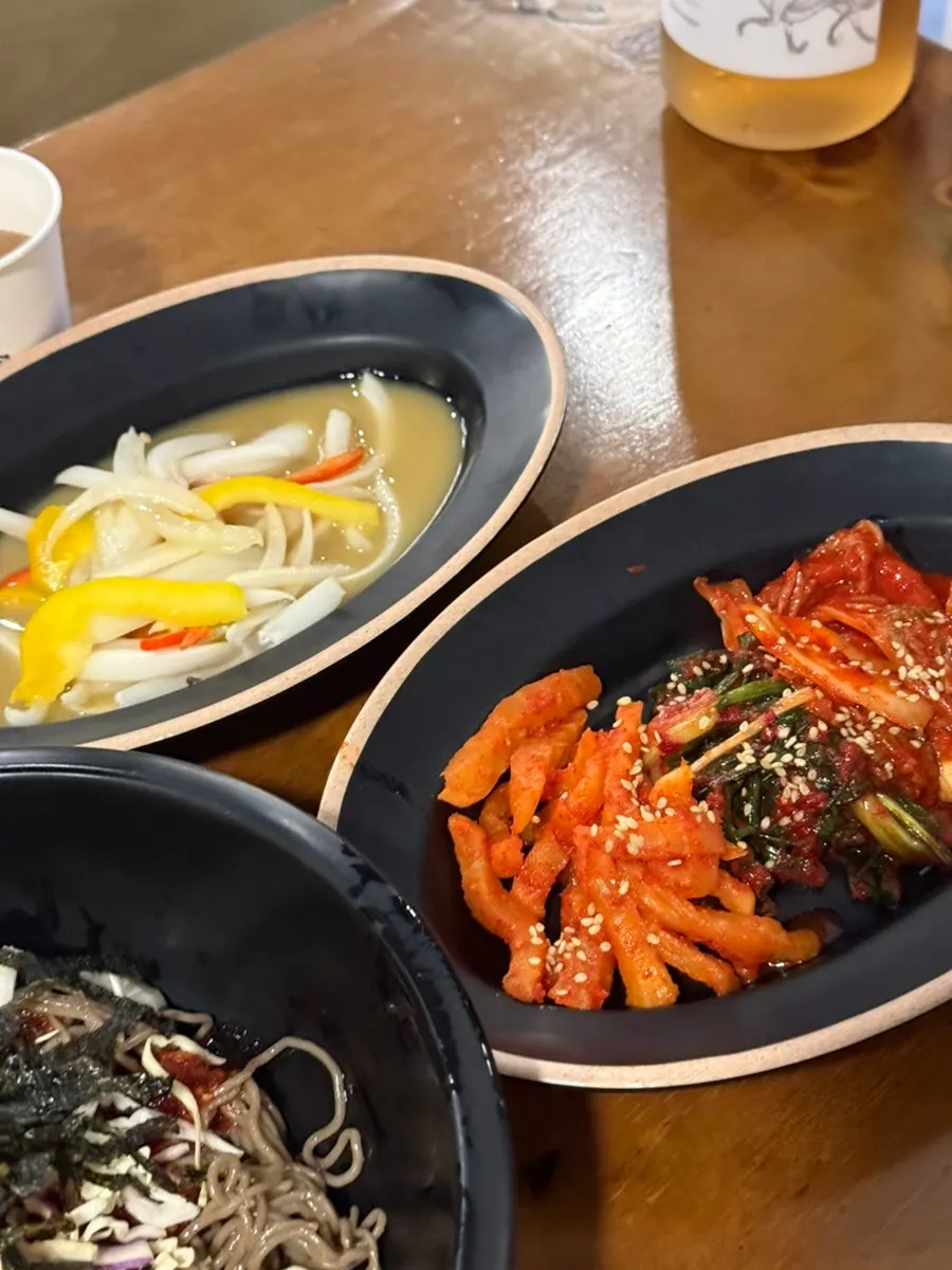 Four kinds of kimchi: radish, green onion, cabbage, and white kimchi